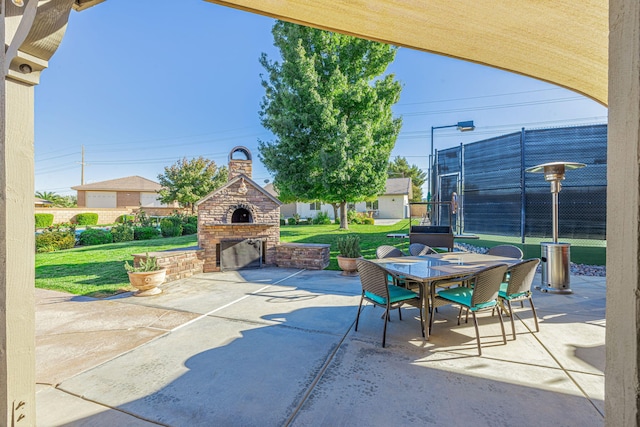 view of patio / terrace featuring an outdoor brick fireplace