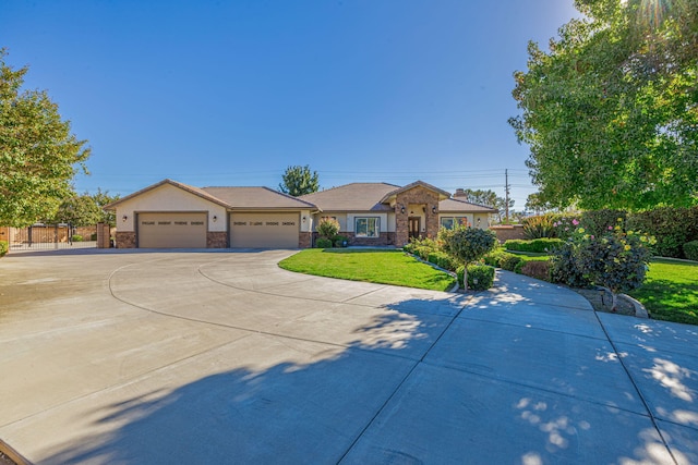 view of front facade featuring a garage and a front lawn