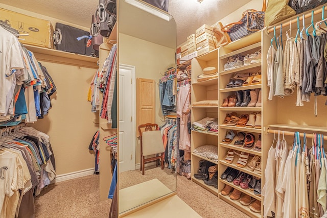 spacious closet with carpet flooring