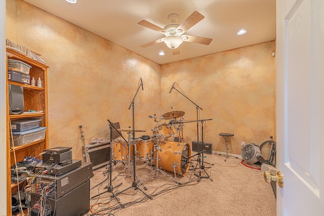 misc room featuring ceiling fan and carpet