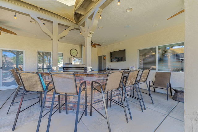 view of patio / terrace featuring exterior bar