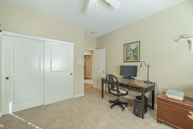 carpeted office featuring ceiling fan