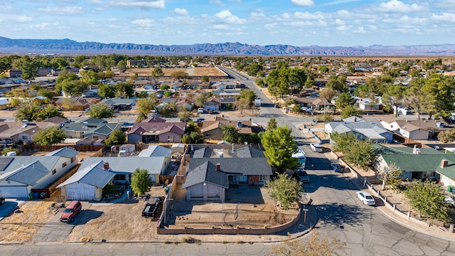 birds eye view of property featuring a mountain view