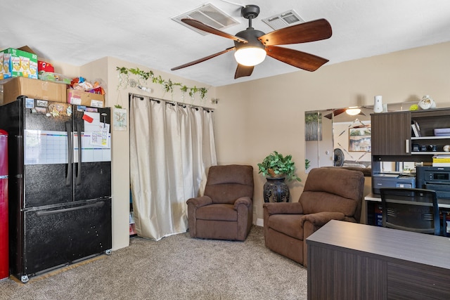 office featuring light colored carpet and ceiling fan