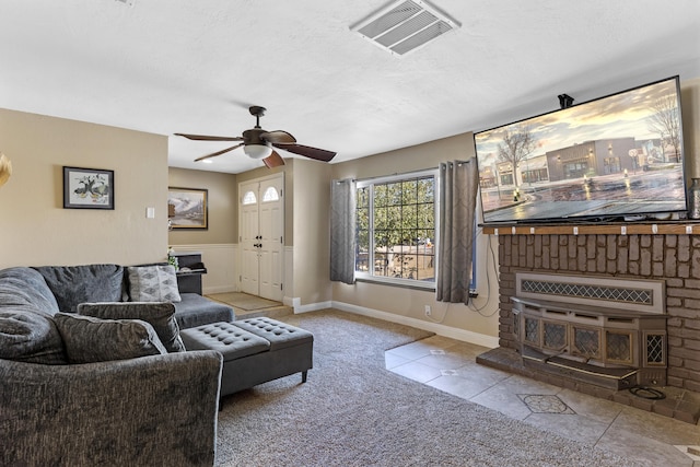 carpeted living room with ceiling fan