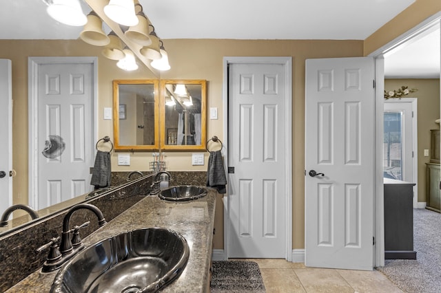 bathroom featuring tile patterned flooring and vanity