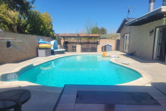 view of swimming pool featuring a patio area