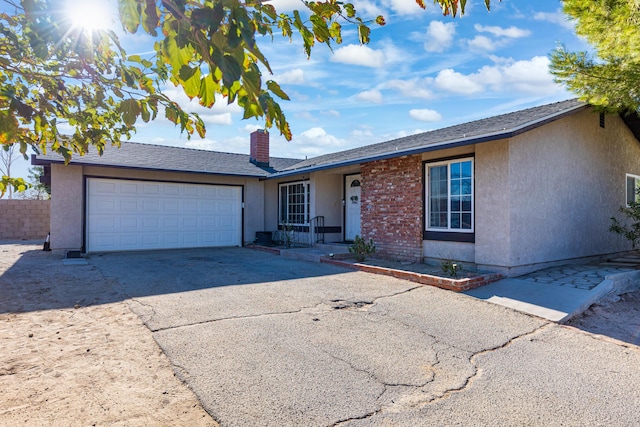 single story home with a garage