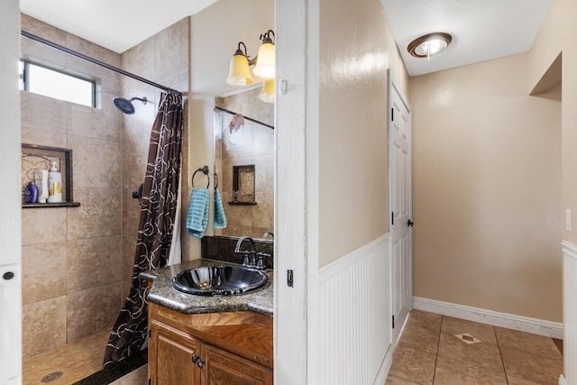 bathroom featuring a shower with curtain, vanity, and tile patterned floors