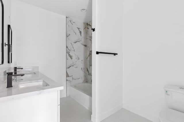 full bathroom with baseboards, tub / shower combination, toilet, and vanity