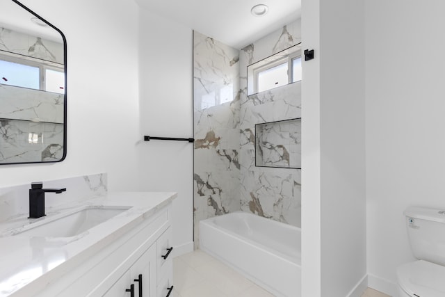 bathroom with baseboards, toilet, shower / bath combination, and vanity