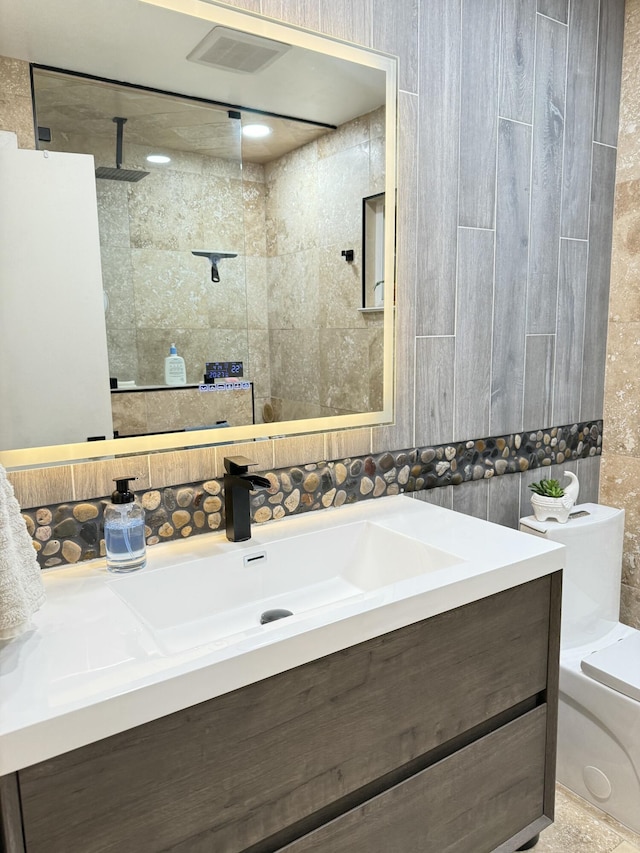 43861 W Elm Ave, Lancaster, CA 93534 - bathroom with vanity, a walk in shower, and tile walls