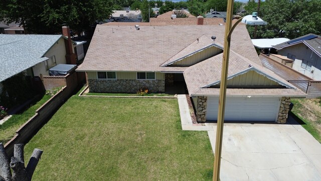 43861 W Elm Ave, Lancaster, CA 93534 - view of front of property featuring stone siding, driveway, and an attached garage