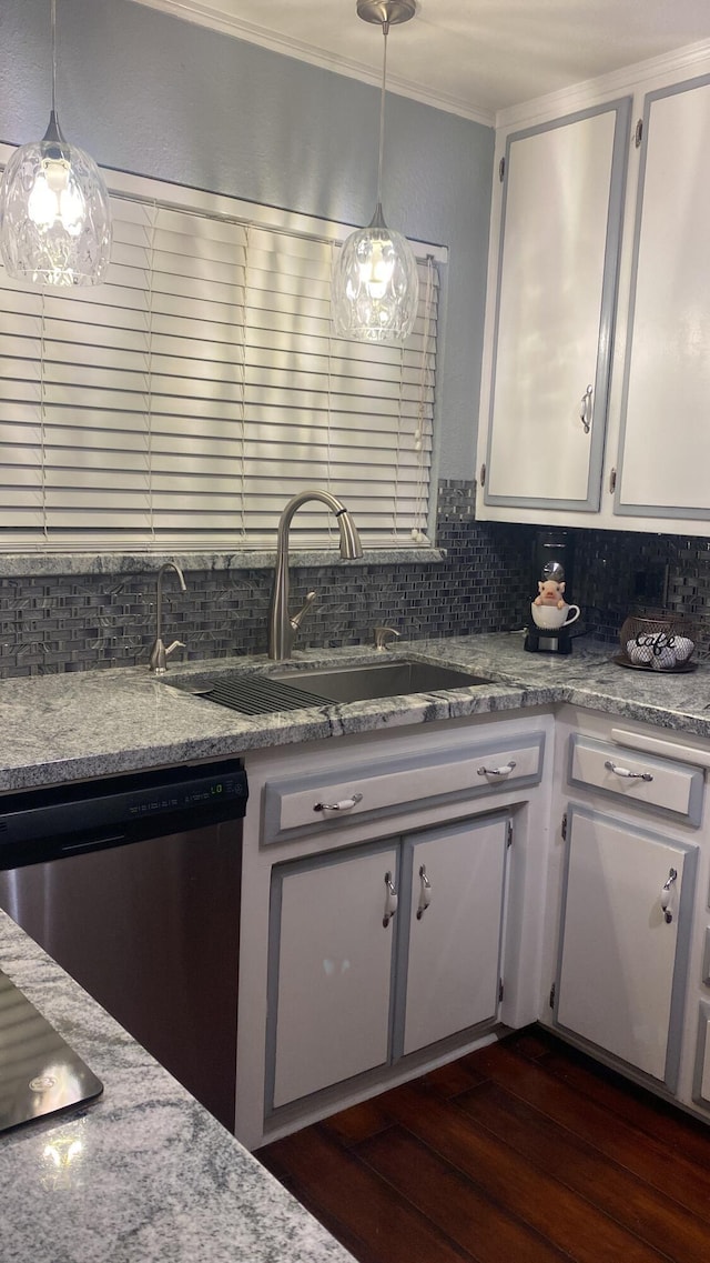 43861 W Elm Ave, Lancaster, CA 93534 - kitchen with stainless steel dishwasher, dark wood-style flooring, a sink, decorative backsplash, and ornamental molding