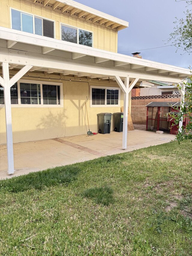 43861 W Elm Ave, Lancaster, CA 93534 - rear view of property featuring a patio area and stucco siding