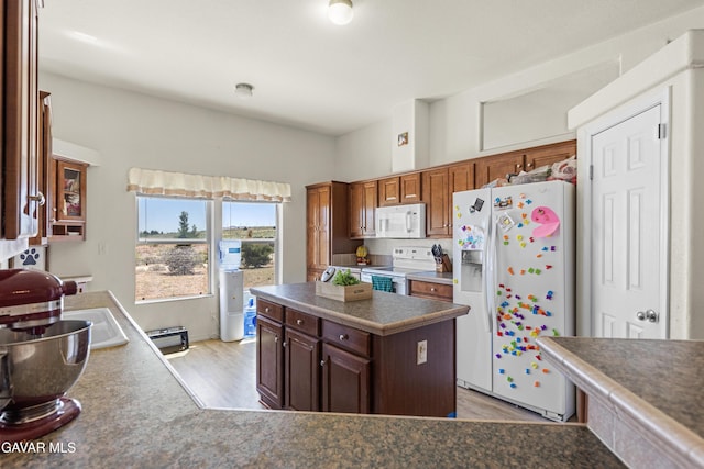 18909 Cheyenne Ave, Tehachapi, CA 93561 - kitchen with white appliances and light wood-style flooring