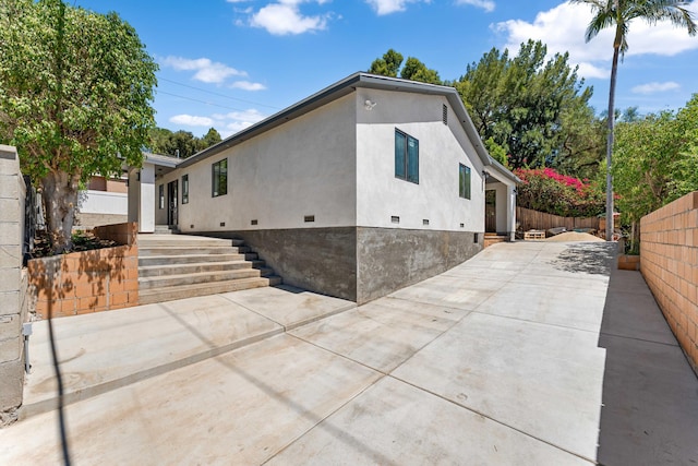 view of home's exterior featuring a patio area