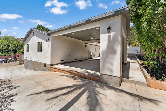 view of side of property with a patio