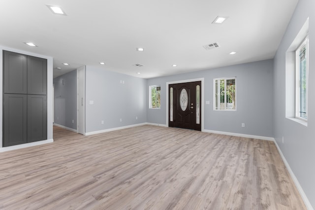 entrance foyer with light hardwood / wood-style flooring