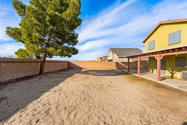 view of yard featuring a fenced backyard and a patio