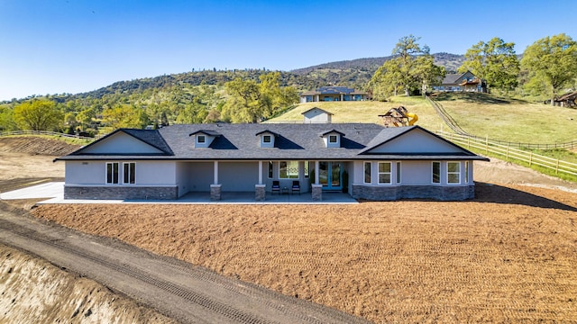 29181 Fawn Way, Tehachapi, CA 93561 - ranch-style home with stone siding, a mountain view, and a patio