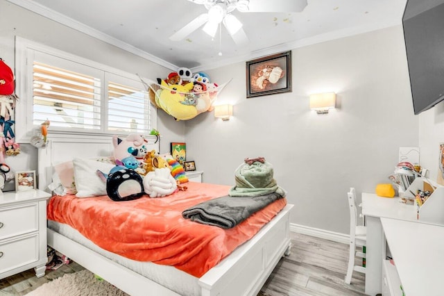 bedroom featuring ceiling fan, light hardwood / wood-style flooring, and ornamental molding