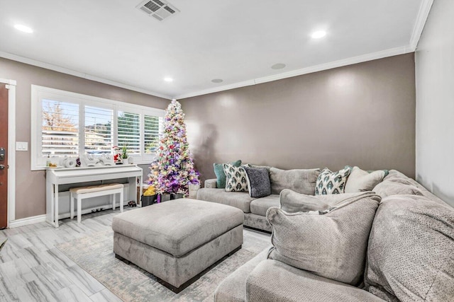 living room featuring light hardwood / wood-style floors and ornamental molding