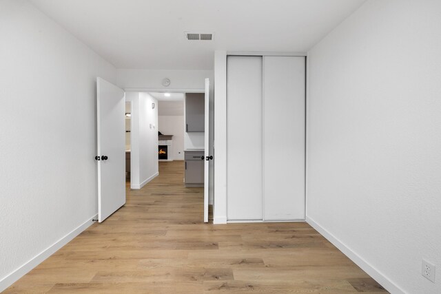 2203 Scott Ave, Palmdale, CA 93550 - corridor featuring baseboards, visible vents, and light wood finished floors