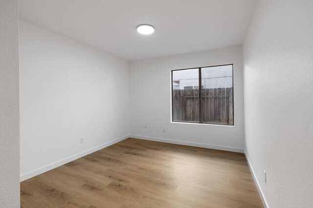 2203 Scott Ave, Palmdale, CA 93550 - empty room featuring light wood-style floors and baseboards