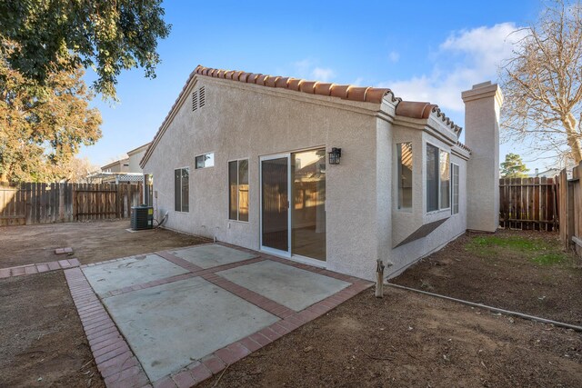 2203 Scott Ave, Palmdale, CA 93550 - rear view of house featuring cooling unit, a patio area, a fenced backyard, and stucco siding
