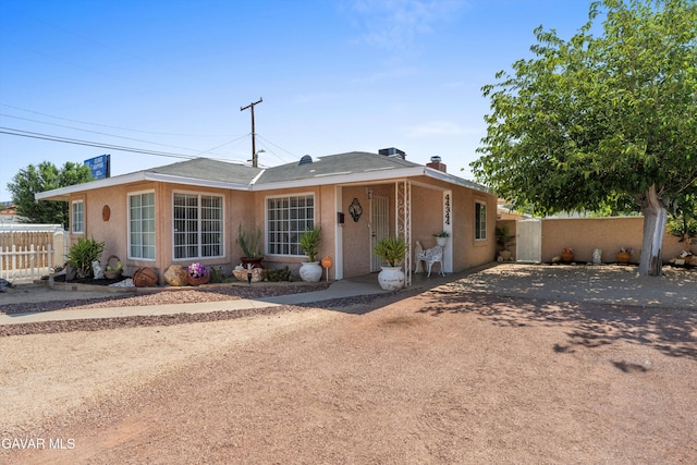 44344 Elm Ave, Lancaster, CA 93534 - view of front of house with stucco siding and a chimney