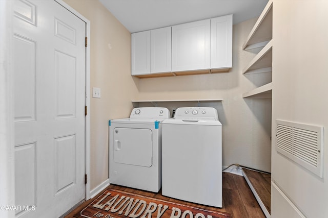 44344 Elm Ave, Lancaster, CA 93534 - laundry area featuring independent washer and dryer, cabinet space, and dark wood-type flooring