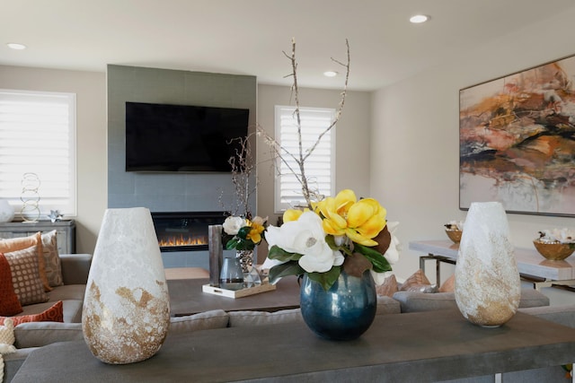 living area featuring recessed lighting and a fireplace