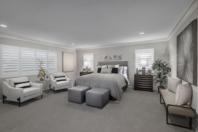 carpeted bedroom with ornamental molding, multiple windows, and recessed lighting