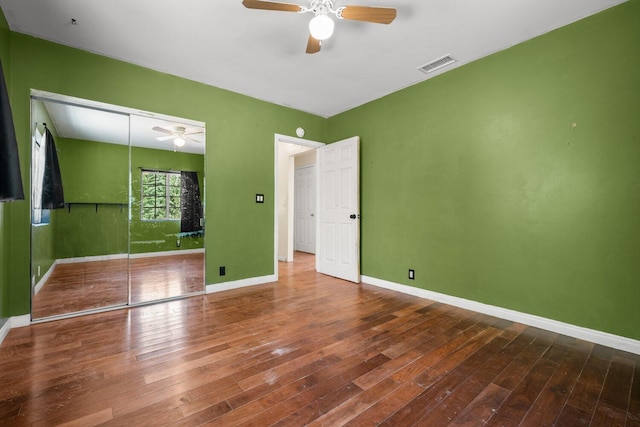 13113 Johnson Rd, Lake Hughes, CA 93532 - unfurnished bedroom featuring hardwood / wood-style floors, ceiling fan, and a closet