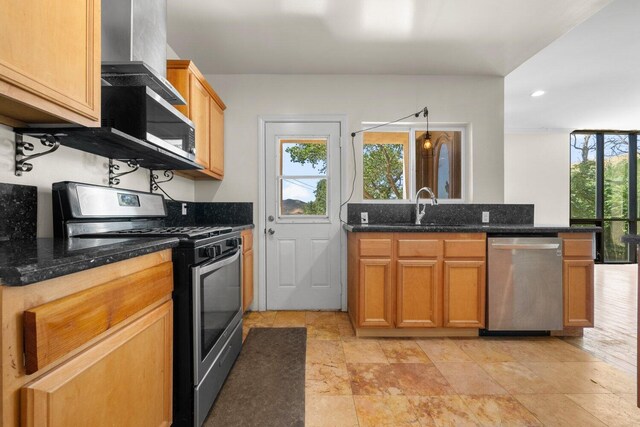 13113 Johnson Rd, Lake Hughes, CA 93532 - kitchen featuring dark stone counters, sink, and stainless steel appliances