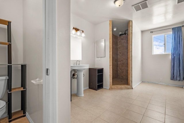 13113 Johnson Rd, Lake Hughes, CA 93532 - bathroom featuring tile patterned floors, sink, toilet, and tiled shower