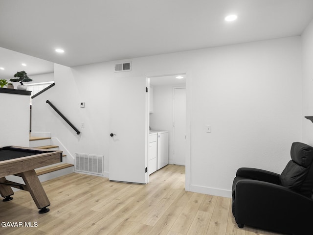 1324 Windermere Ct, Palmdale, CA 93551 - sitting room with washing machine and clothes dryer, light wood-style flooring, recessed lighting, and stairs