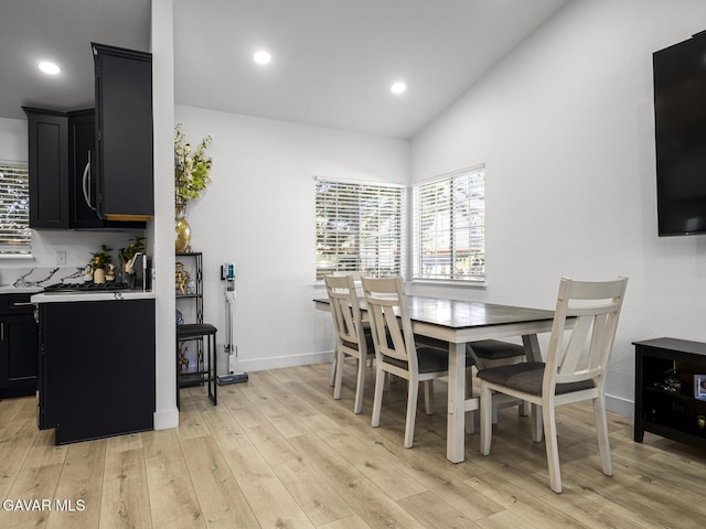 1324 Windermere Ct, Palmdale, CA 93551 - dining space with light wood-type flooring, vaulted ceiling, and recessed lighting
