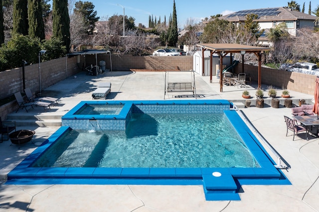 40947 Ridgegate Ln, Palmdale, CA 93551 - view of swimming pool featuring a storage unit, a fenced backyard, a patio area, an outdoor structure, and an in ground hot tub