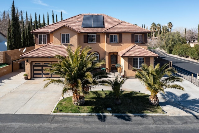 40947 Ridgegate Ln, Palmdale, CA 93551 - mediterranean / spanish home featuring solar panels, a tile roof, stucco siding, and driveway