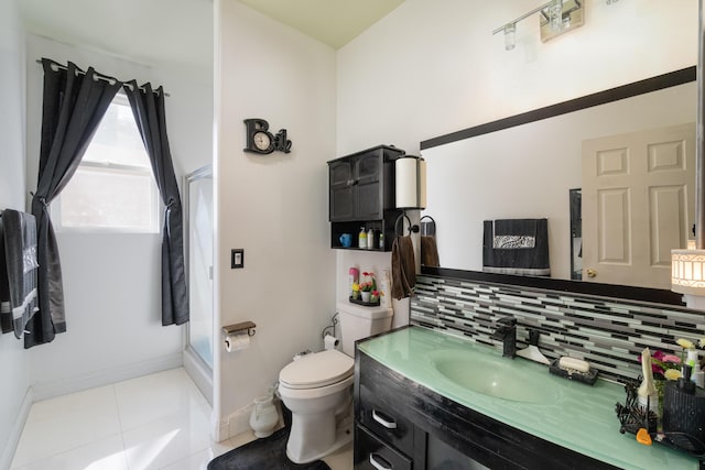 40947 Ridgegate Ln, Palmdale, CA 93551 - bathroom featuring tile patterned floors, backsplash, toilet, vanity, and baseboards
