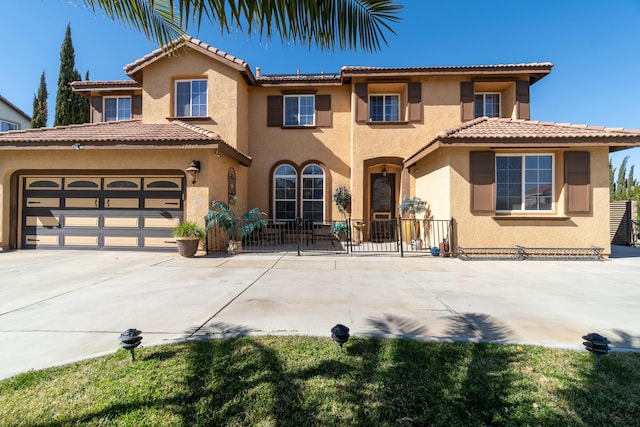 40947 Ridgegate Ln, Palmdale, CA 93551 - mediterranean / spanish home with a tile roof, driveway, and stucco siding
