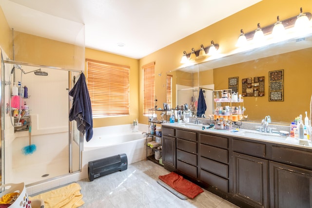 40947 Ridgegate Ln, Palmdale, CA 93551 - full bathroom featuring double vanity, a bath, a stall shower, and a sink