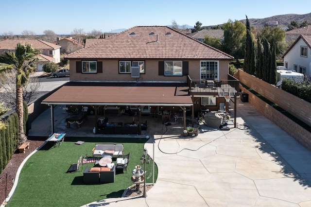 40947 Ridgegate Ln, Palmdale, CA 93551 - rear view of house with fence, a patio area, a tile roof, and stucco siding