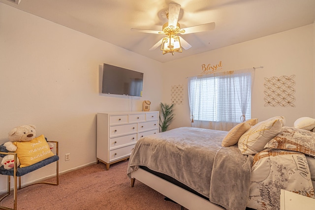 bedroom featuring baseboards, ceiling fan, and carpet floors