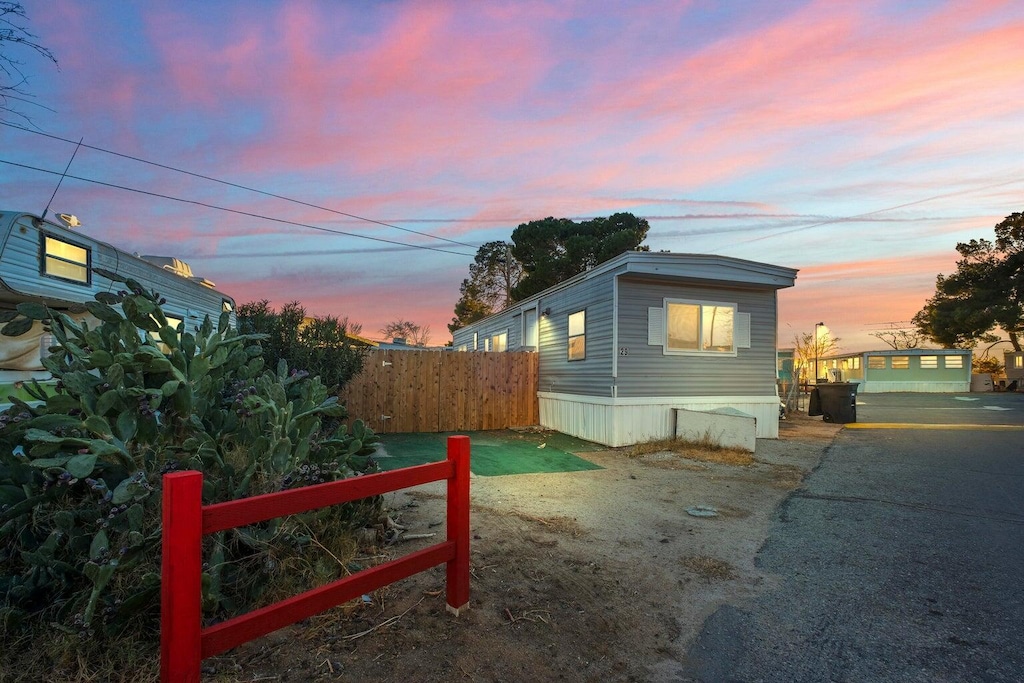 view of home's exterior featuring fence