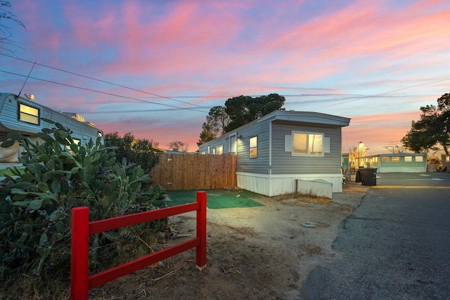 view of home's exterior featuring fence