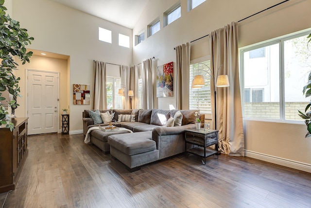 28097 Promontory Ln, Valencia, CA 91354 - living area with baseboards, dark wood-type flooring, and a towering ceiling