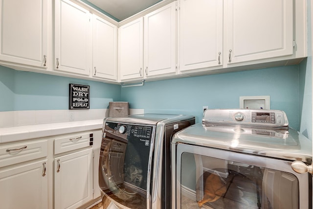 28097 Promontory Ln, Valencia, CA 91354 - washroom with independent washer and dryer and cabinet space